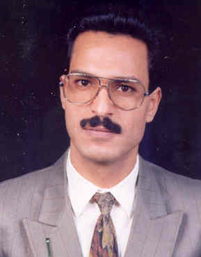 صورة رسمي كامل محمد بدر